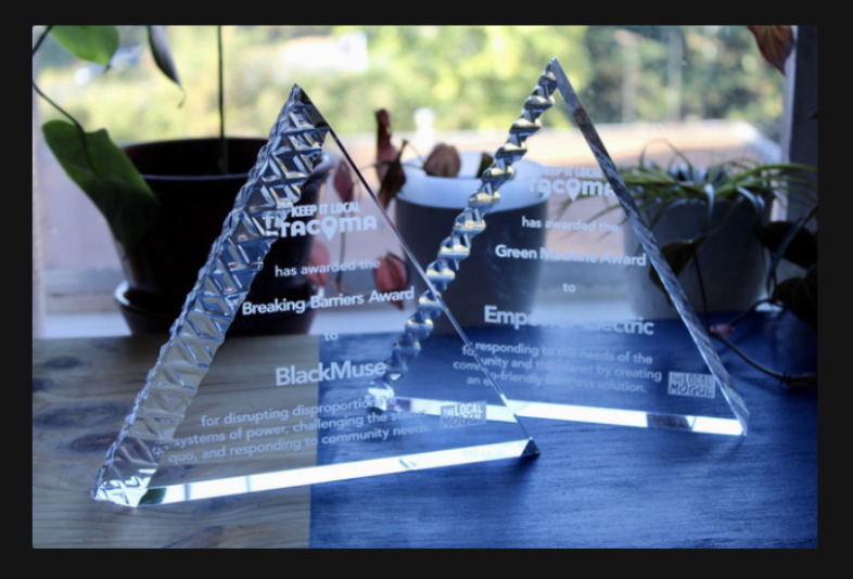 Close-up of the engraved Breaking Barriers Award presented to BlackMuse