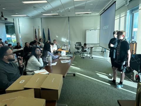 Two students present their pitch together